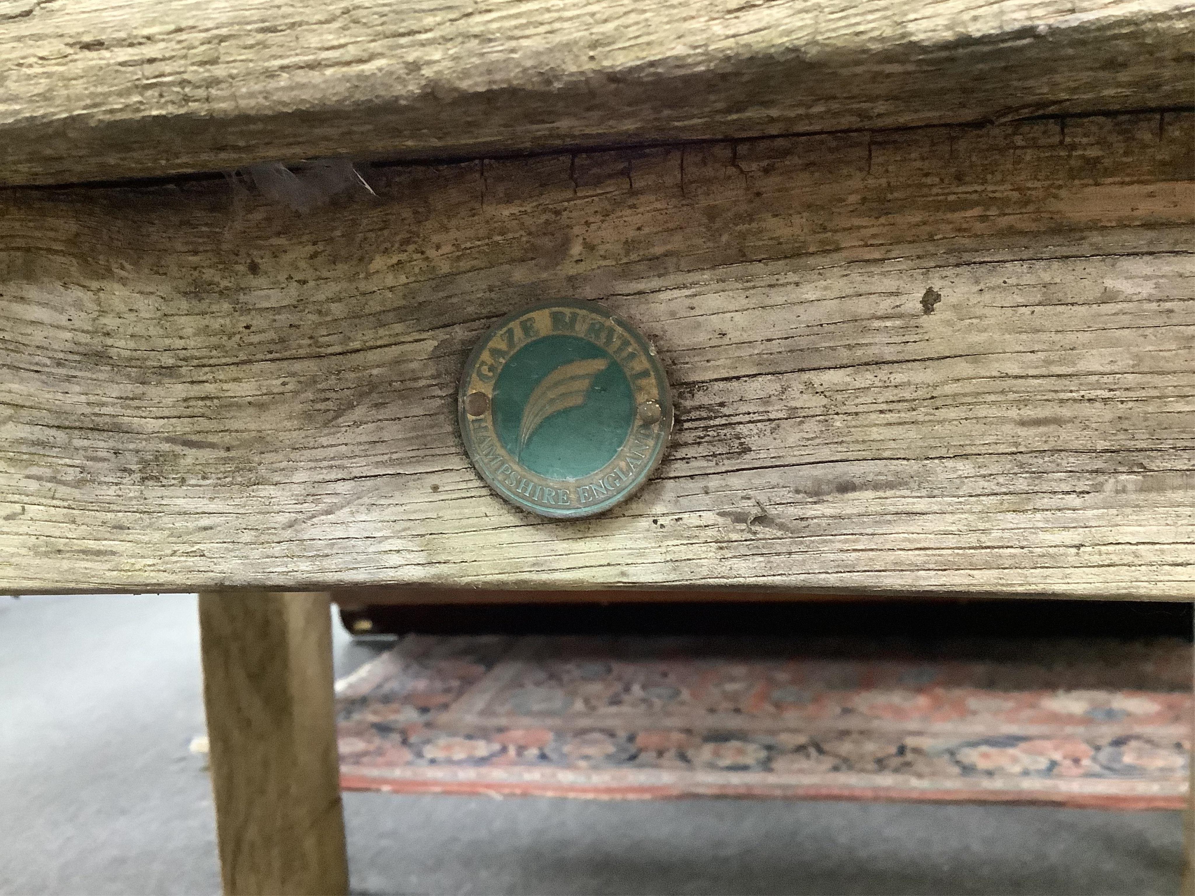A Gaze Burvill steam bent oak “Court” garden bench, width 146cm, depth 58cm, height 79cm. Condition - fair